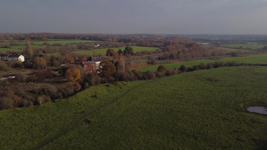 Aerial shot of a field in Abram.