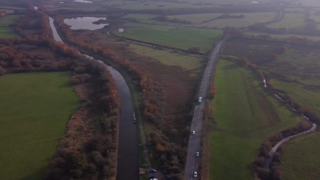 Aerial shot of the Leeds-Liverpool Canal in Abram, with Warrington Road to the right.